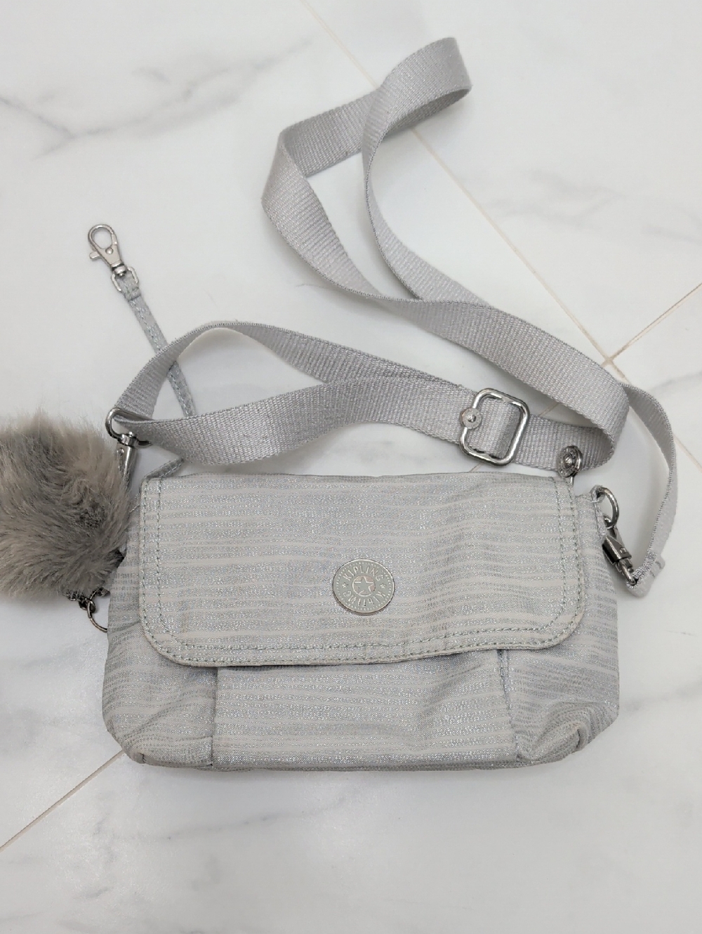 Light Gray Kipling Crossbody Bag with Pom Accent